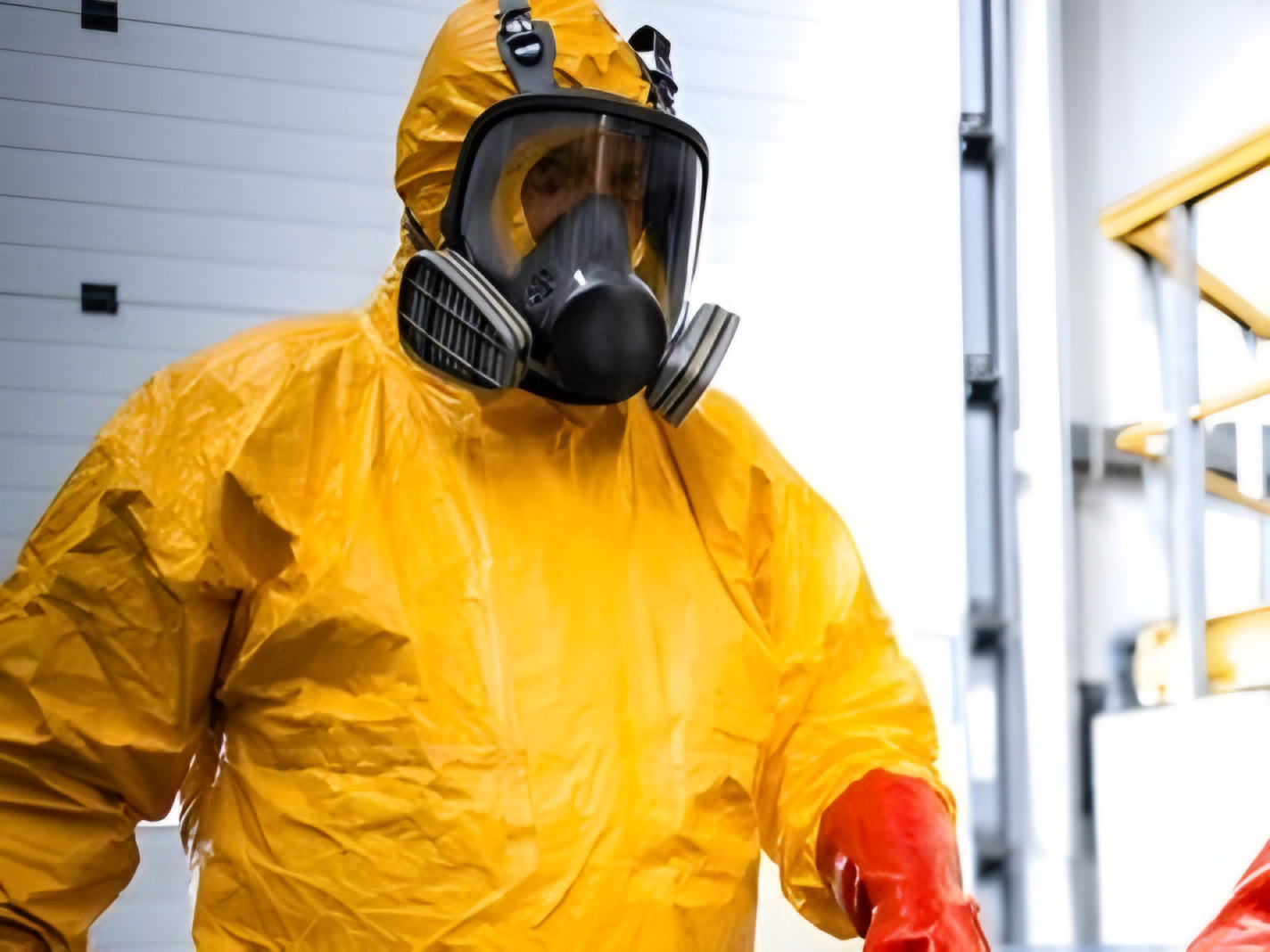 Image showing two individuals in PPE kits cleaning hazardous chemical gases commonly found in household, kitchen, and office waste. Accompanying text highlights potential health risks including eye, respiratory, and nervous system effects from exposure to these gases